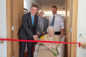 Staff and Residents Cutting Ribbon For Rubislaws Opening